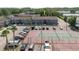 Aerial view of condo complex with tennis court and parking at 4030 Cortez Dr # C, Tampa, FL 33614