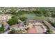 Aerial view of the condominium complex showing the buildings, parking, a nearby lake and recreation areas at 4030 Cortez Dr # C, Tampa, FL 33614