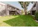 Lush backyard with green lawn and stairway to upper floors at 4030 Cortez Dr # C, Tampa, FL 33614