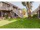 Expansive backyard with lush green grass and access stairs at 4030 Cortez Dr # C, Tampa, FL 33614