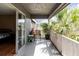 Relaxing balcony with seating and views of tropical foliage at 4030 Cortez Dr # C, Tampa, FL 33614