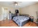 Comfortable bedroom featuring a ceiling fan and an ensuite bathroom at 4030 Cortez Dr # C, Tampa, FL 33614