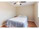 Comfortable bedroom with wood floors, ceiling fan, and large window at 4030 Cortez Dr # C, Tampa, FL 33614