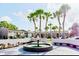 View of the community's grounds, featuring a beautiful fountain and mature palm trees at 4030 Cortez Dr # C, Tampa, FL 33614