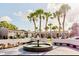 Beautiful community featuring a water fountain, palm trees, and well-maintained apartment buildings at 4030 Cortez Dr # C, Tampa, FL 33614