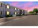 Exterior view of a well-maintained apartment building with dark brown shutters under a colorful evening sky at 4030 Cortez Dr # C, Tampa, FL 33614
