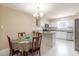 Eat-in kitchen with white cabinets, stainless steel appliances, and granite countertops at 4030 Cortez Dr # C, Tampa, FL 33614
