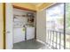 Functional laundry area with washer, dryer, and shelving for storage at 4030 Cortez Dr # C, Tampa, FL 33614