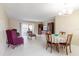 Bright living room features tile flooring, access to the balcony and a dining area at 4030 Cortez Dr # C, Tampa, FL 33614