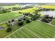 Expansive aerial view of the property with farmland, lakes and greenery all around at 4030 Moores Lake Rd, Dover, FL 33527