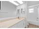 Bathroom features a vanity, large mirror, and shower at 4030 Moores Lake Rd, Dover, FL 33527
