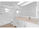 Well-lit bathroom featuring a spacious vanity, large mirror, and a shower at 4030 Moores Lake Rd, Dover, FL 33527