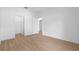 Light filled bedroom featuring wood floors and ample closet space at 4030 Moores Lake Rd, Dover, FL 33527