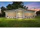 Charming single-story home featuring a well-manicured lawn, newly painted exterior, and inviting front porch at 4030 Moores Lake Rd, Dover, FL 33527