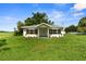 Beautiful single-story home surrounded by lush greenery, offering a serene setting at 4030 Moores Lake Rd, Dover, FL 33527