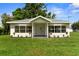 Charming single-story home with a well-manicured lawn and manicured flower beds at 4030 Moores Lake Rd, Dover, FL 33527