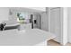 Bright kitchen showcasing white cabinets, stainless steel appliances, and plenty of counter space at 4030 Moores Lake Rd, Dover, FL 33527