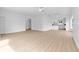 Expansive living room featuring hardwood floors, ceiling fans, and smooth transitions into adjoining spaces at 4030 Moores Lake Rd, Dover, FL 33527