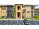 Inviting condo building with well-manicured landscaping and convenient parking at 4306 Bayside Village Dr # 201, Tampa, FL 33615