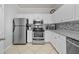 Bright kitchen with stainless steel appliances and granite countertops at 4306 Bayside Village Dr # 201, Tampa, FL 33615