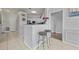 Stylish kitchen with breakfast bar, bar stools, and modern decor at 4306 Bayside Village Dr # 201, Tampa, FL 33615