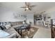 Spacious living room featuring a large sectional sofa and tile flooring at 4306 Bayside Village Dr # 201, Tampa, FL 33615