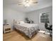 Bright bedroom featuring a ceiling fan, wood floors and a sunny window for a comfortable space at 4325 Aegean Dr # 250B, Tampa, FL 33611