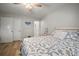 Spacious bedroom with a ceiling fan, closet and doorway that leads to the ensuite bathroom at 4325 Aegean Dr # 250B, Tampa, FL 33611