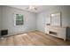 Bedroom with window letting in natural light and features a light-colored wooden floor and furniture at 4325 Aegean Dr # 250B, Tampa, FL 33611