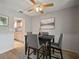 Inviting dining room with table, chairs, fan and nice floors creating a comfortable and stylish space at 4325 Aegean Dr # 250B, Tampa, FL 33611