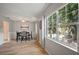 Bright dining area with pool views, lovely floors, and a contemporary table and chair set at 4325 Aegean Dr # 250B, Tampa, FL 33611