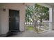 Inviting entryway with a secure dark door, complemented by the lush greenery and courtyard view at 4325 Aegean Dr # 250B, Tampa, FL 33611