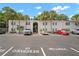 Exterior of a well-maintained two-story building with lush landscaping and ample parking at 4325 Aegean Dr # 250B, Tampa, FL 33611