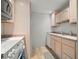 Efficient kitchen layout with white appliances and light-colored cabinetry, ensuring a clean aesthetic at 4325 Aegean Dr # 250B, Tampa, FL 33611
