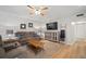 Comfortable living room with a plush sofa, warm lighting, and a large TV for entertainment at 4325 Aegean Dr # 250B, Tampa, FL 33611