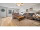 Cozy living room features neutral decor, a ceiling fan, and plenty of natural light, creating a welcoming space at 4325 Aegean Dr # 250B, Tampa, FL 33611