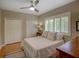 Bedroom with ceiling fan, plantation shutters, closet, and a queen bed at 4335 Clairidge Way, Palm Harbor, FL 34685