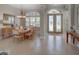 Formal dining area with elegant chandelier and views of the landscaped front yard at 4335 Clairidge Way, Palm Harbor, FL 34685