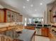 Open kitchen features dark countertops, ample cabinetry, and a view into the living room at 4335 Clairidge Way, Palm Harbor, FL 34685