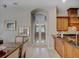 View of the kitchen featuring a counter, island, and doorway leading to another room at 4335 Clairidge Way, Palm Harbor, FL 34685