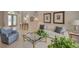 Spacious living room with comfortable seating and a view of the home's entry at 4335 Clairidge Way, Palm Harbor, FL 34685