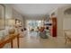 Bright living room with tile flooring and large windows overlooking the pool area at 4335 Clairidge Way, Palm Harbor, FL 34685