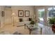 Bright living room featuring a view of the pool and patio through large sliding doors at 4335 Clairidge Way, Palm Harbor, FL 34685