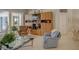 Comfortable living room with custom built-in storage and access to the outdoor patio at 4335 Clairidge Way, Palm Harbor, FL 34685