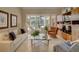 Cozy living room with sliding glass doors leading to an outdoor pool and patio at 4335 Clairidge Way, Palm Harbor, FL 34685