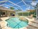 Sparkling screened pool with spa and lounge chairs, perfect for outdoor relaxation at 4335 Clairidge Way, Palm Harbor, FL 34685