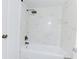 Bright bathroom featuring a shower with marble tile surround and sleek bronze fixtures at 4411 Shady Terrace Ln # 213, Tampa, FL 33613