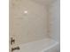 Shower with marble tile surround and sleek bronze fixtures at 4411 Shady Terrace Ln # 213, Tampa, FL 33613