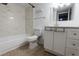 Bright bathroom with modern finishes, including white marble shower and white vanity with ample storage at 4411 Shady Terrace Ln # 213, Tampa, FL 33613