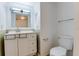 Bathroom features a vanity with drawers, toilet and a towel bar at 4411 Shady Terrace Ln # 213, Tampa, FL 33613